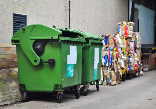 Workers managing construction debris responsibly